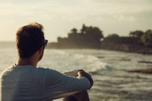 man relaxing on Laguna Beach after dialectical behavior therapy