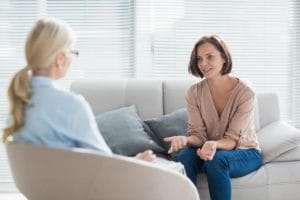 woman talking to therapist about visiting Oceanfront Recovery's xanax addiction treatment center