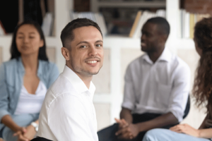 a diverse group opens up and supports each other in group therapy as part of cocaine addiction treatment