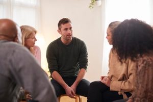 Folks sitting in therapy in a substance abuse treatment center