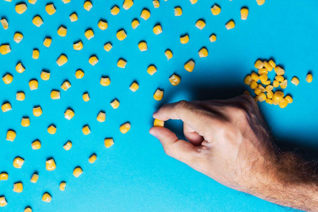 Man in need of OCD treatment lines up kernels of corn